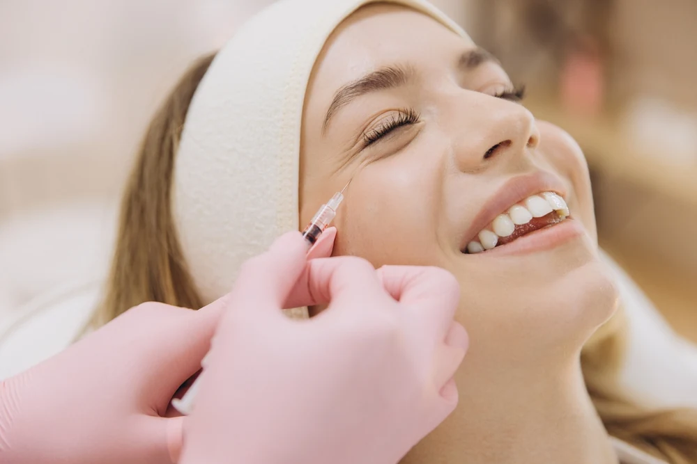 A client receiving a facial injectable treatment